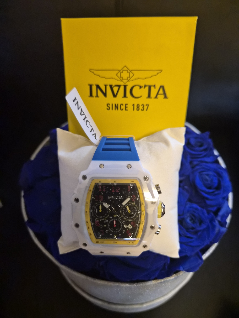Invicta White Watch with Blue Strap and Yellow Bezel Accents